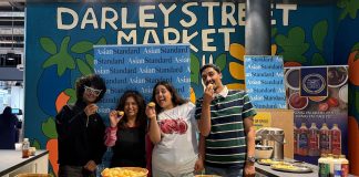 Asian Standard team serving up Heera Gol Gappa at Darley Street Market, with locals queuing up to try the South Asian street food favourite.